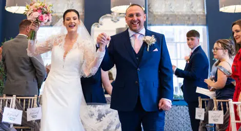 Bride and groom celebrating at Bury St Edmunds Register Office