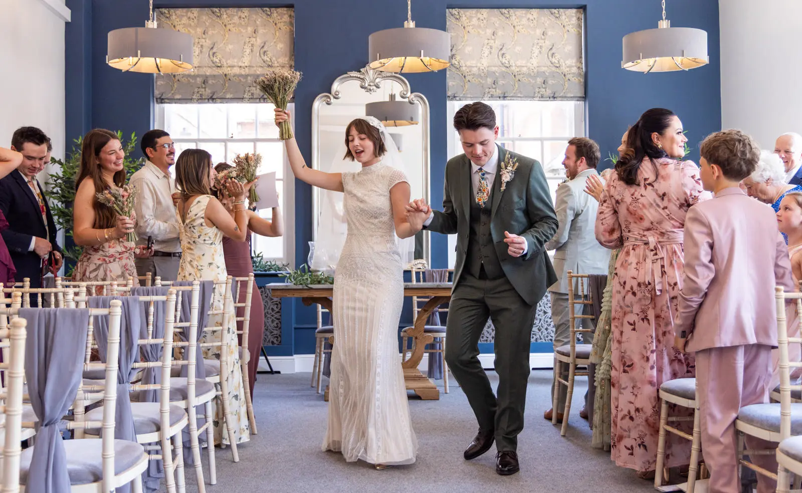 Bride and groom dancing in the aisle Bury St Edmunds register Office