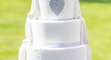 Beautiful four tiered wedding cake on silver plate