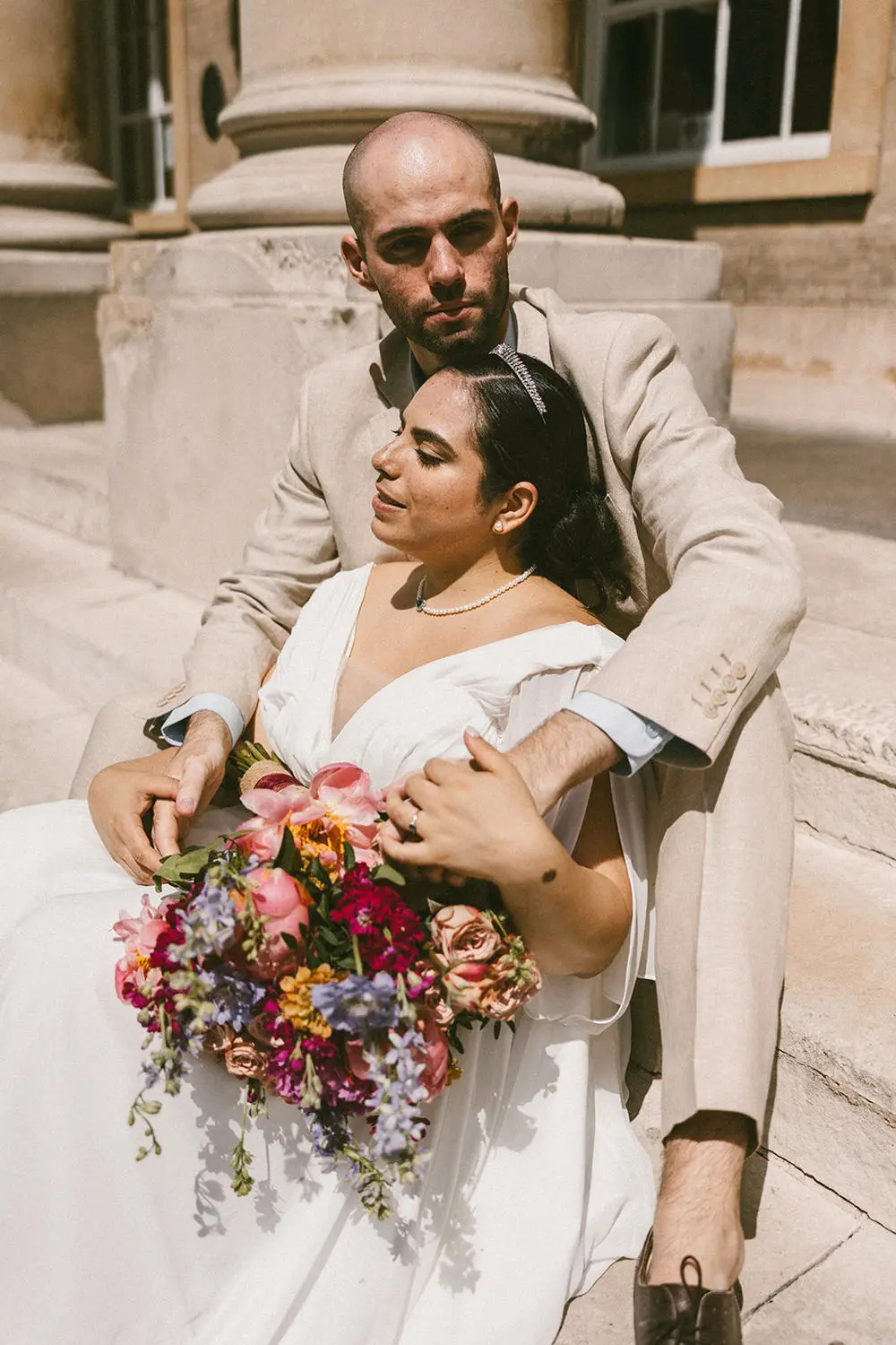 bride and groom on stairs