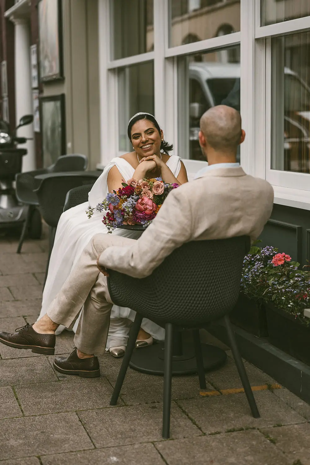 Bride and groom on chairs
