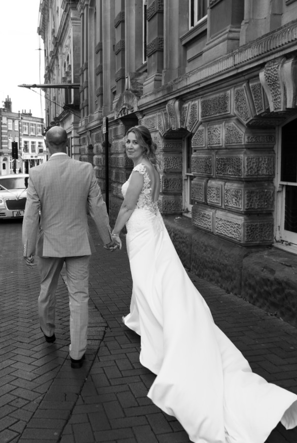 Couple walking outside Ipswich Town Hall