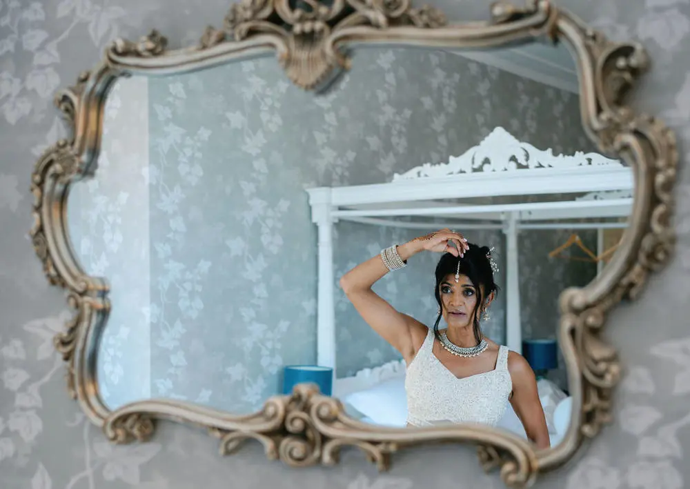 bride adjusting bindhi