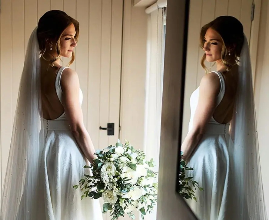 Beautiful bride with dainty bouquet