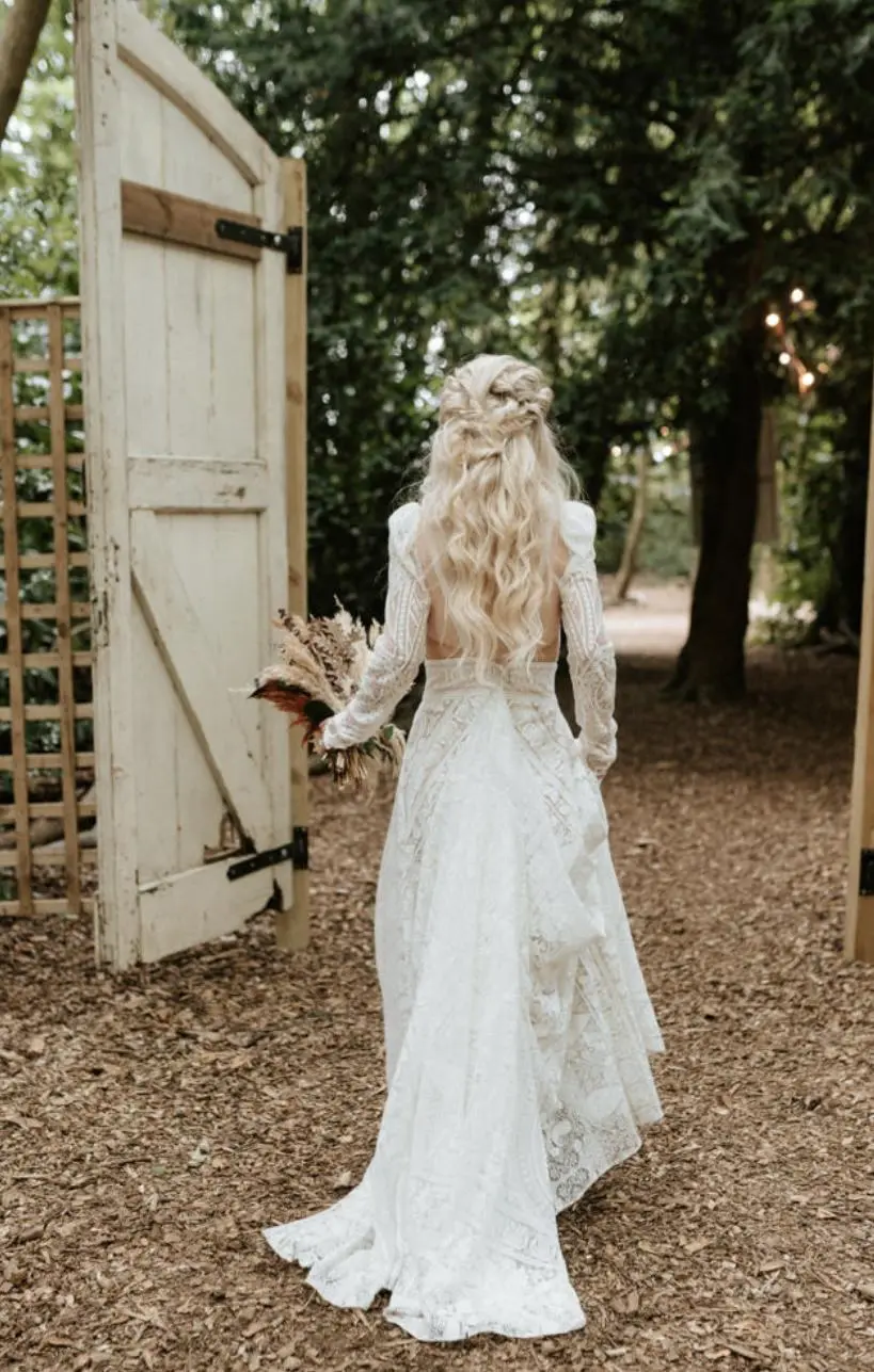 Bride walking towards a gate