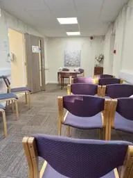 Purple chairs facing forward in a ceremony room