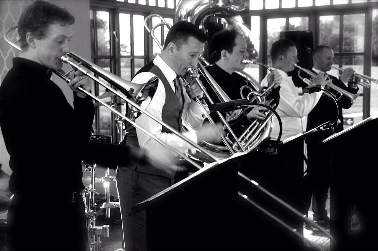 Five-piece brass ensemble playing