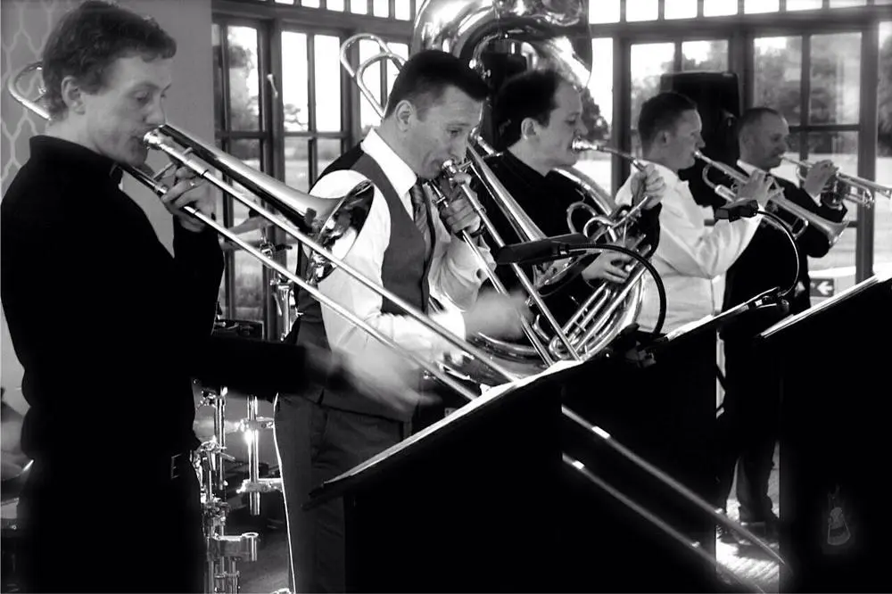 Five-piece brass ensemble playing