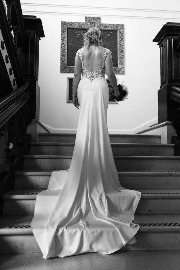 Rear view of bride on stairs