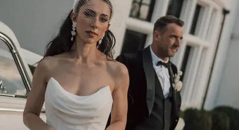 Bride and groom looking stern