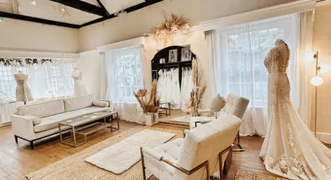 Lavender and Jude bridal boutique inside white and cream interior sofas and chairs