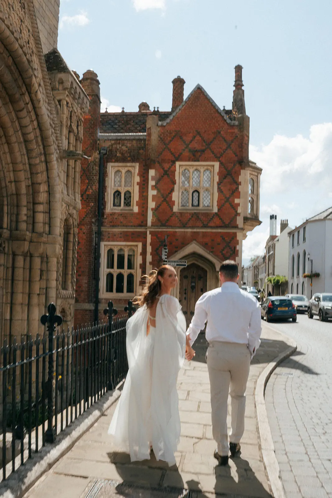 Couple walking on Angel Hill, Bury St Edmunds