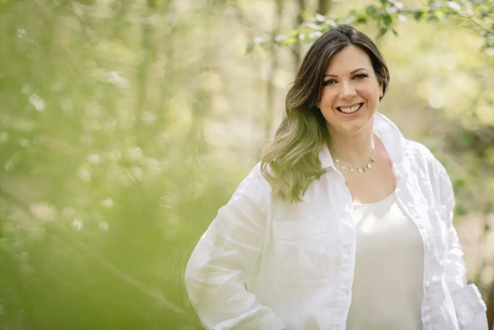 Louis May Wedding planner wearing white shirt smiling