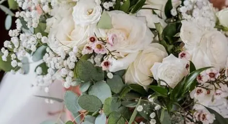 Bridal bouquet with white roses and foliage