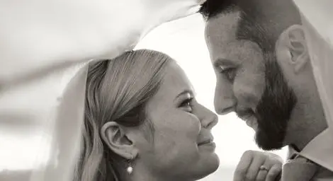 Bride and groom gazing at each other black and white photo