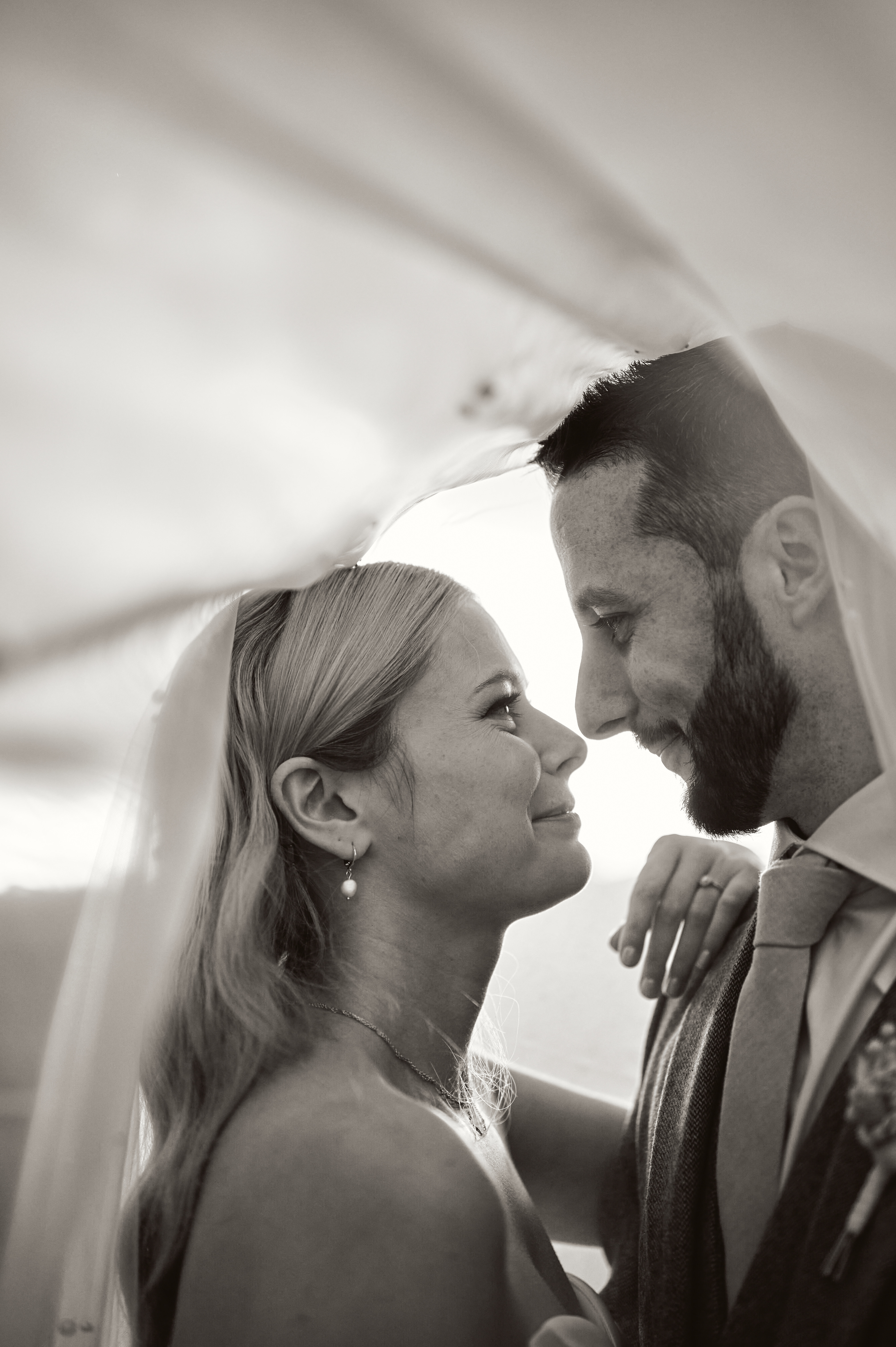Bride and groom gazing at each other black and white photo