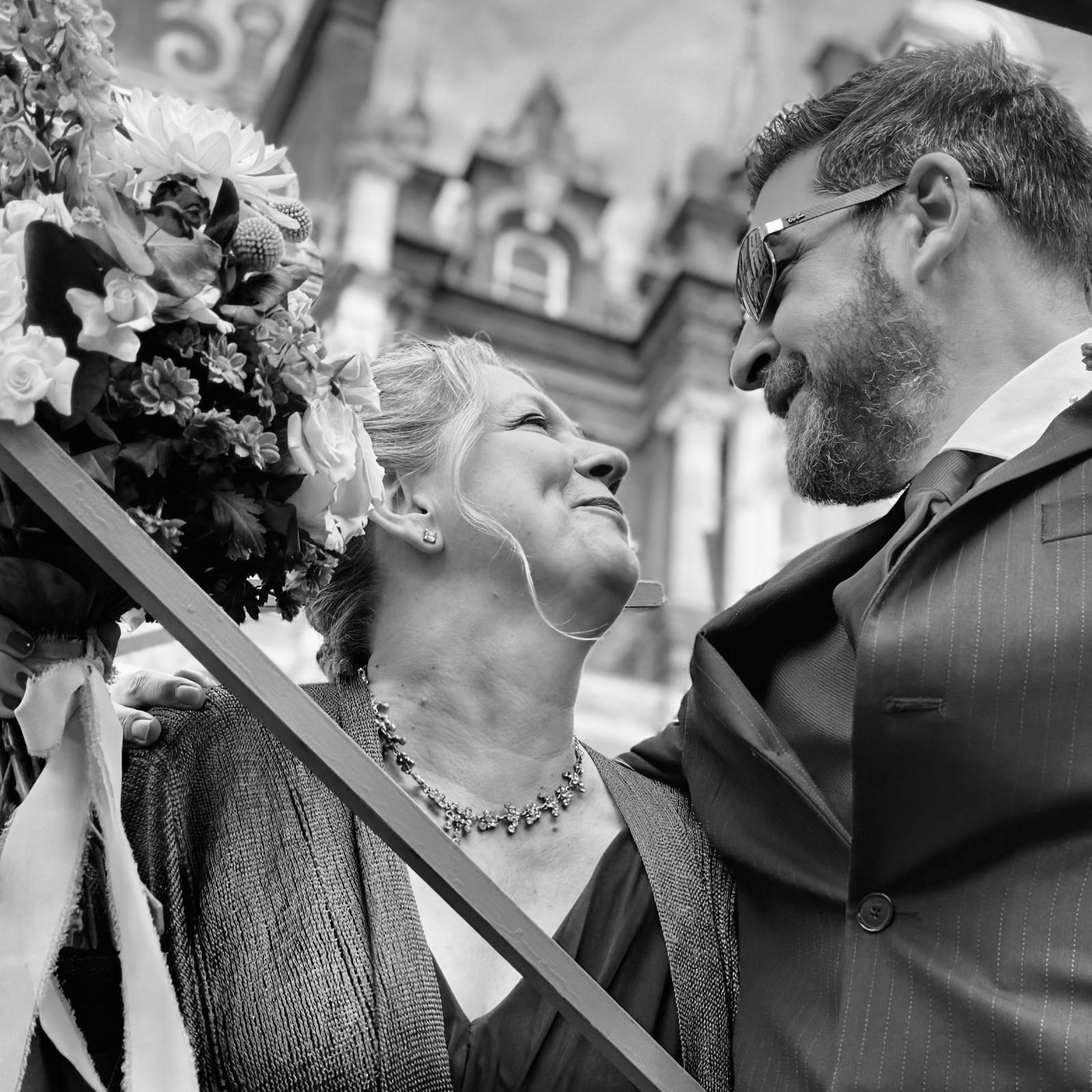 Couple black and white image smiling at each other
