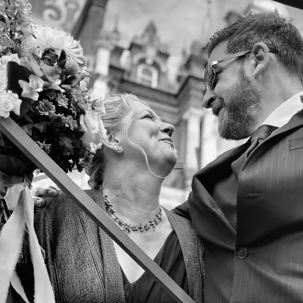 Couple black and white image smiling at each other