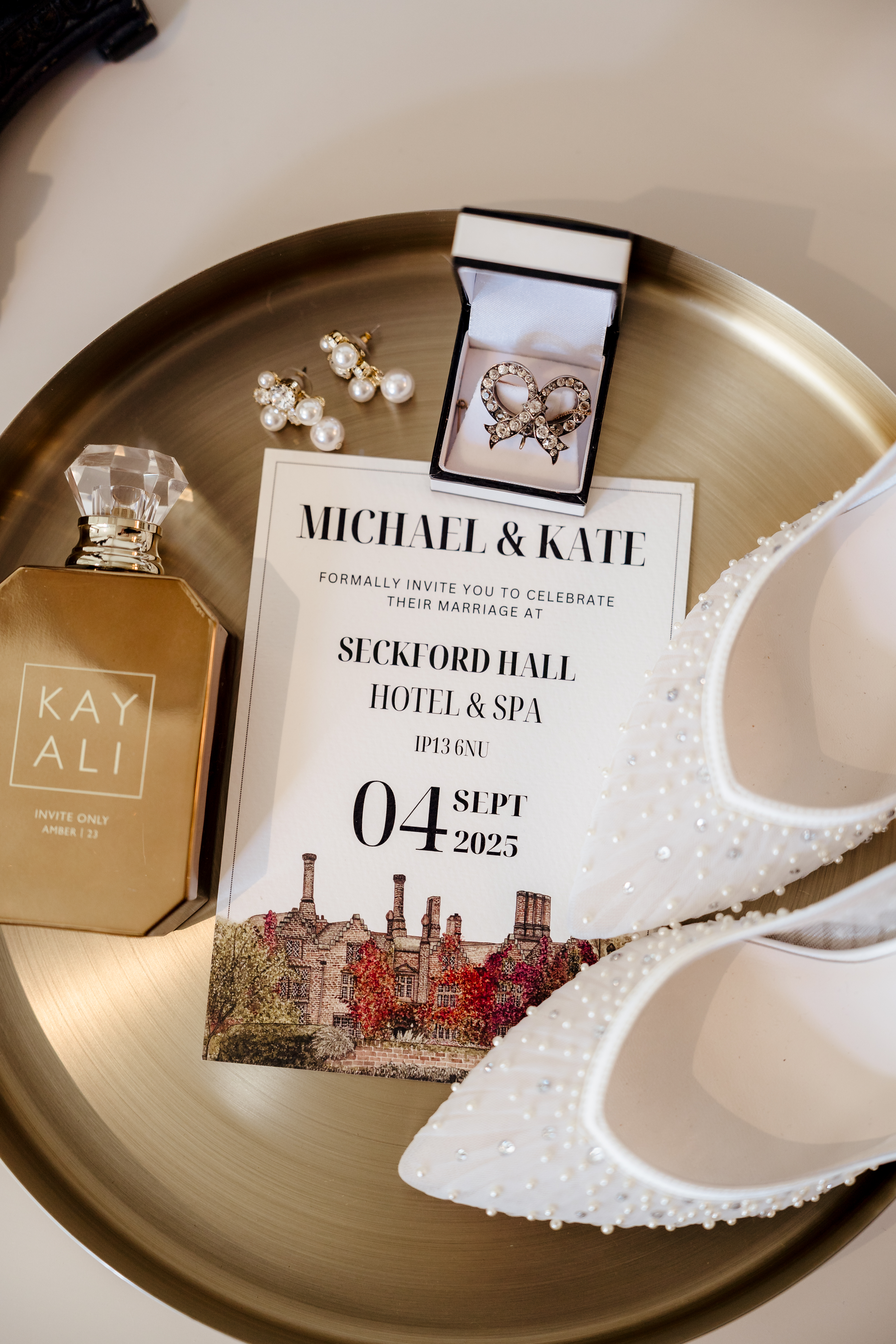 Wedding invitation for Michael & Kate with pearl heels and perfume
