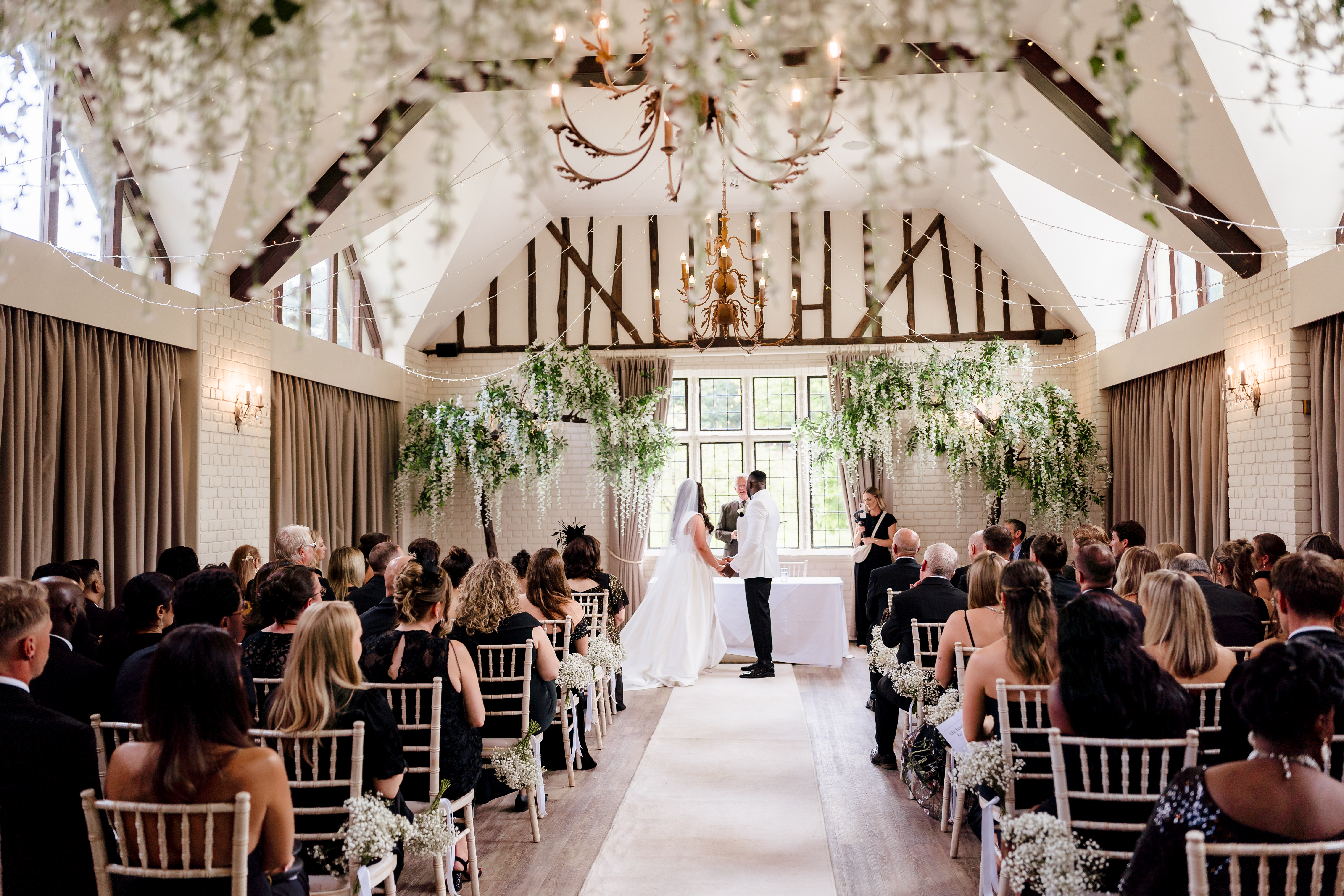 Couple standing at table with registrar