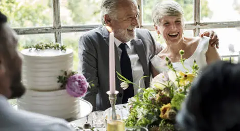 senior-couple-sitting-and-smiling
