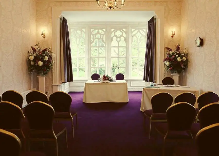 Purple carpet with chairs facing forward in ceremony room 