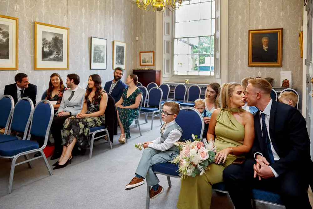 Guests awaiting couple at the Mayor's Parlour at the Sudbury Town Hall for their wedding