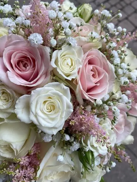 Bridal bouquet with pink and white roses and greenery
