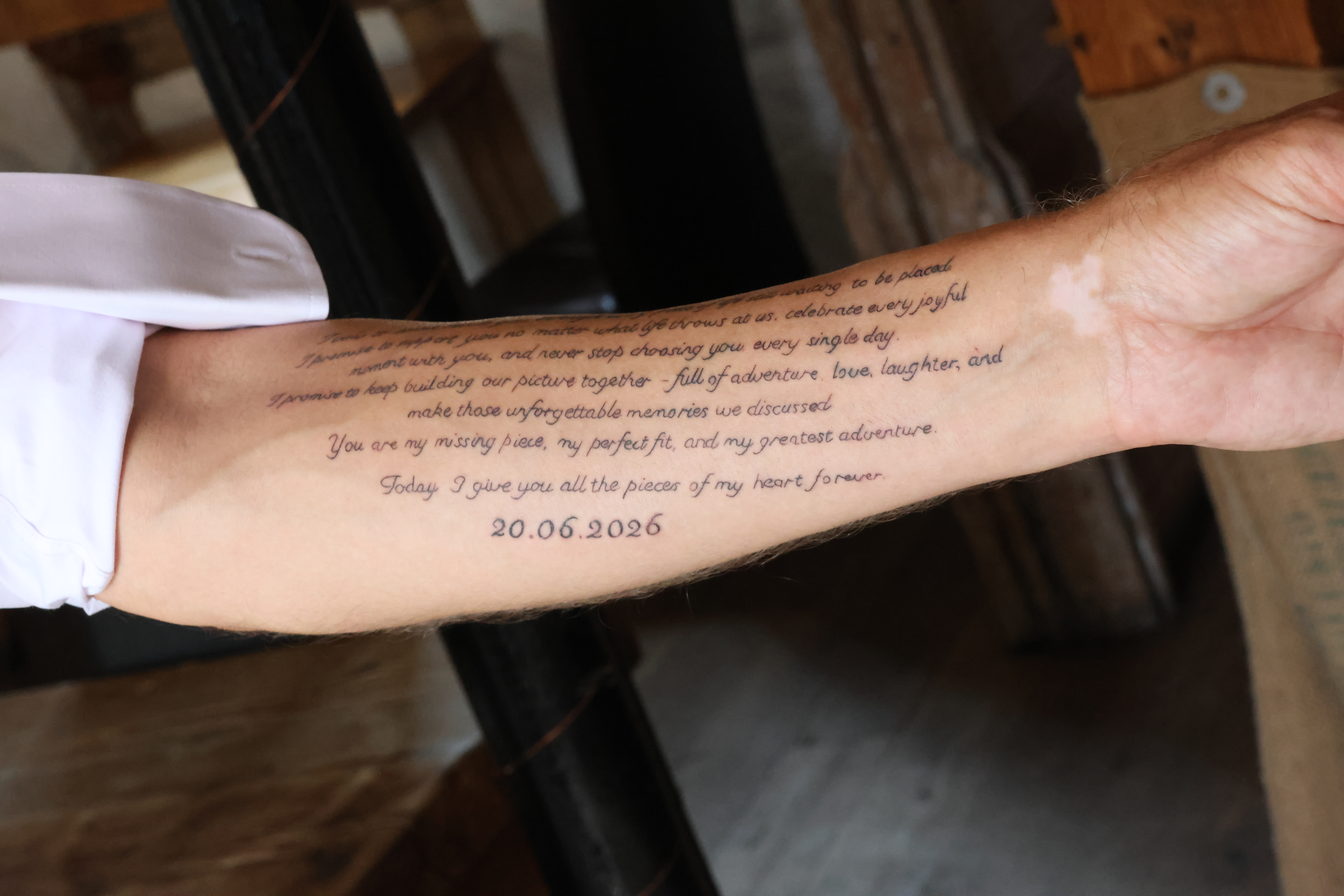 Wedding vows tattooed on grooms forearm