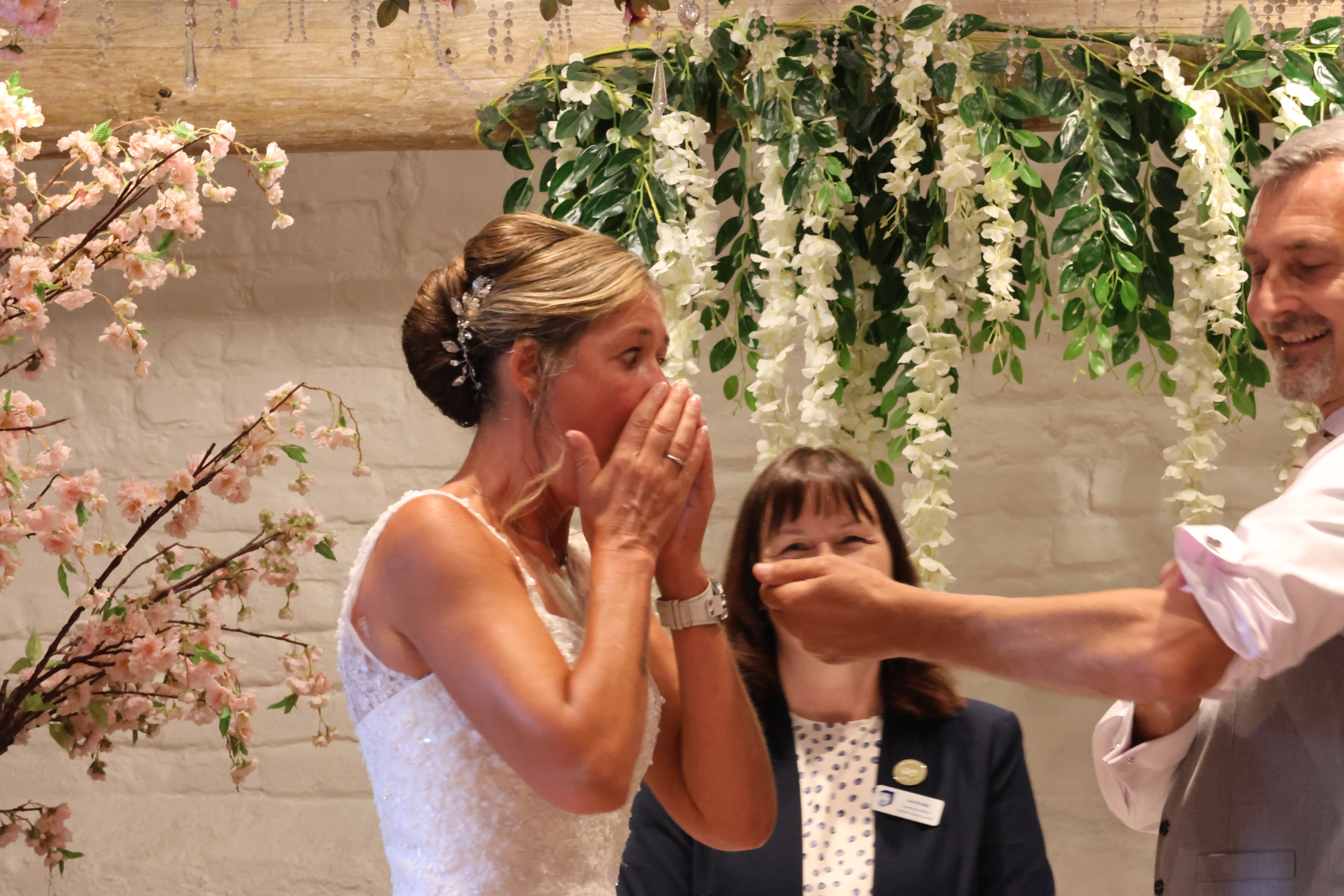 Groom shows bride vows tattooed on his arm