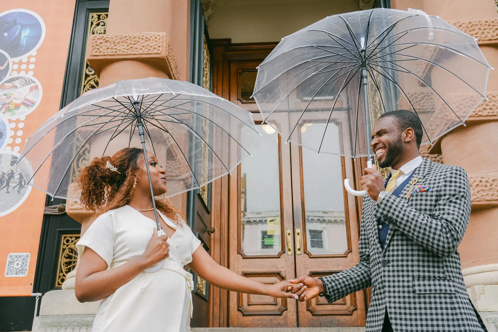 Bride and groom with umbrellas