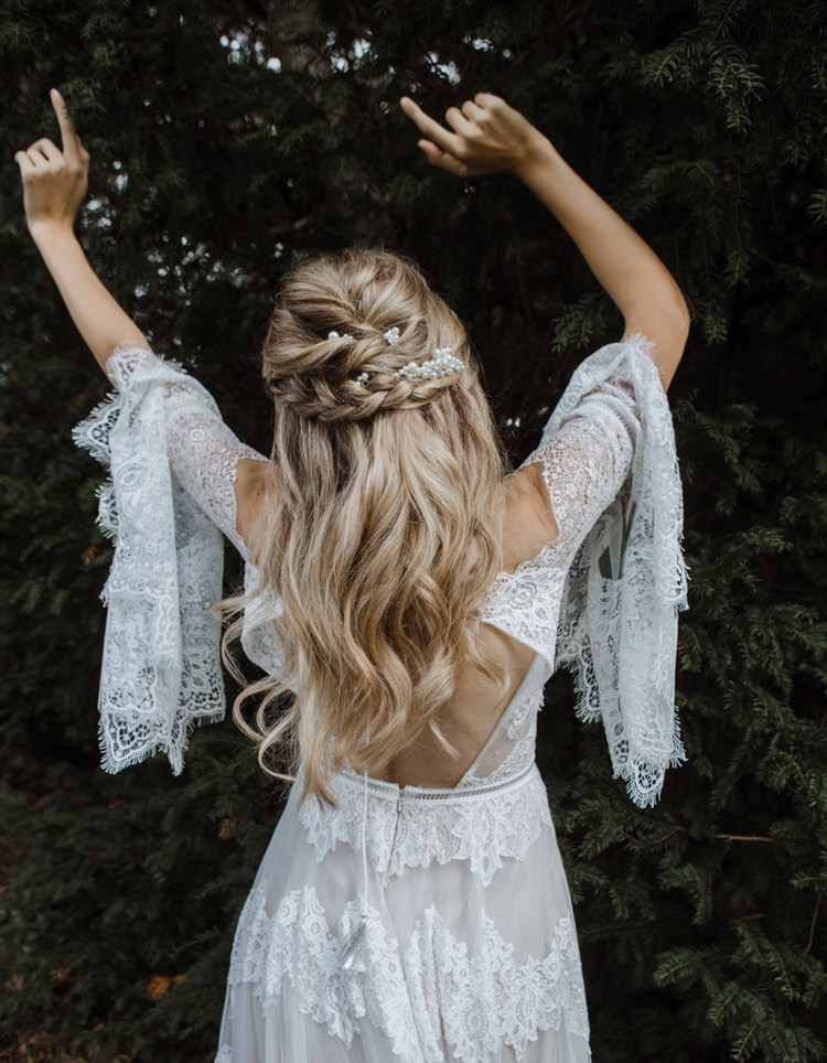 Beautiful bride with long blond hair in braided updo