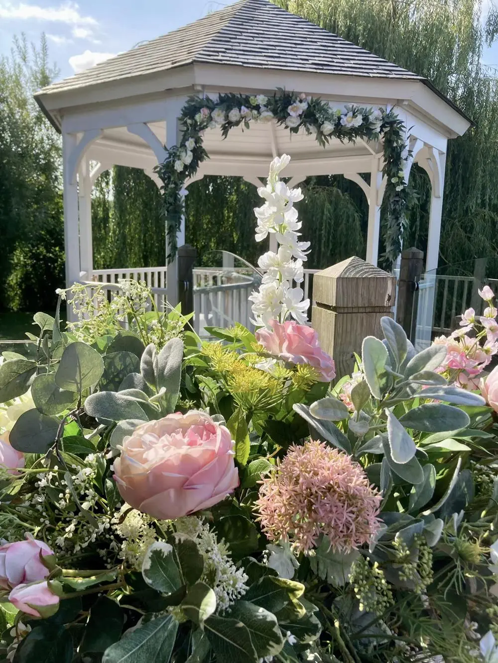 Beautiful floral bouquet outside a garden structure