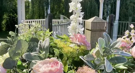 Beautiful bouquet outside a garden structure