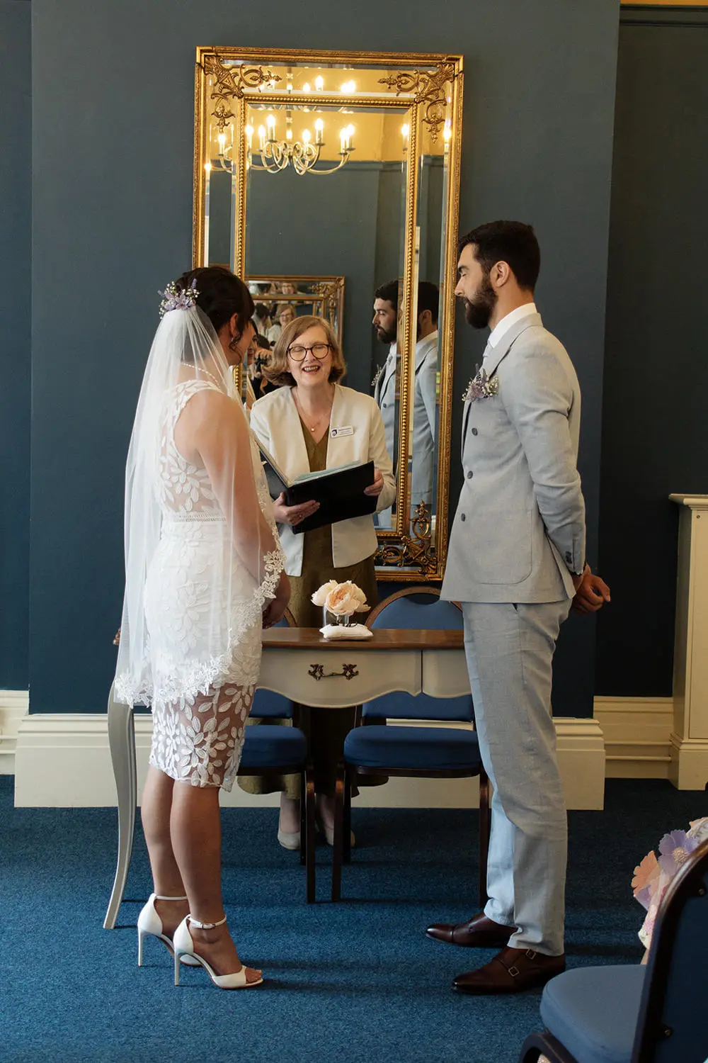 Wedding ceremony at the Pickwick Room at Ipswich Town Hall. Bride and Groom with Suffolk Registrars Celebrant