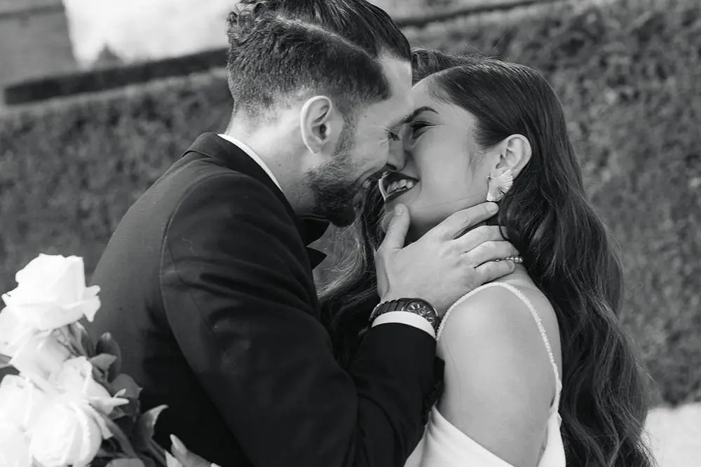 Couple kissing in black and white photo