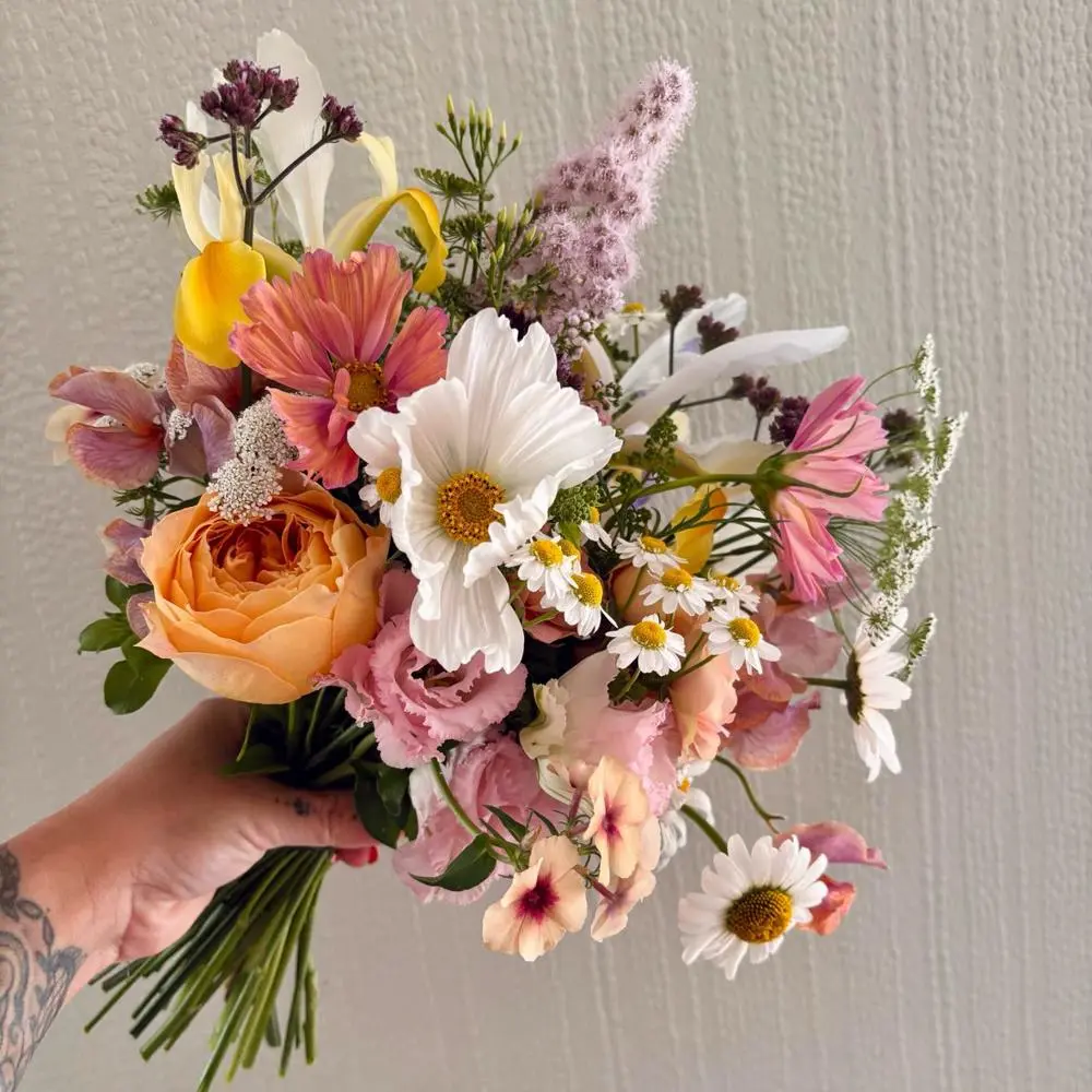 Beautiful bouquet with apricot, pale pink and white flowers