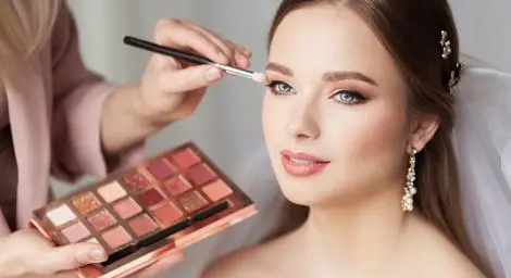 Young bride having her wedding make up done.